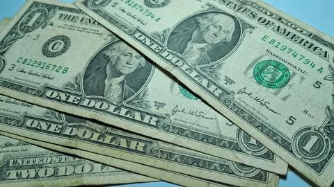 Close-up of US dollar bills with worn appearance. Financial documents and cash Stock Photos