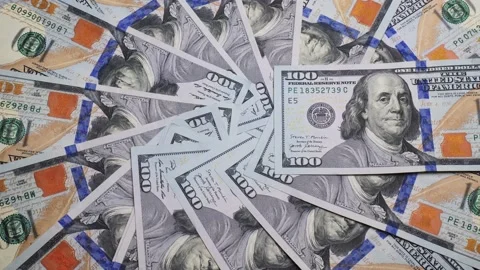 Close-up of US dollars. 100 dollars spinning in a circle Stock Footage 228824477