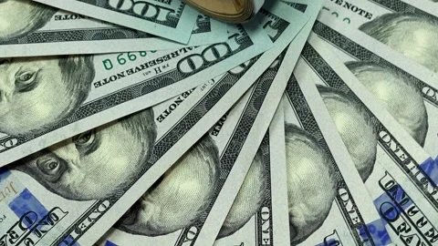 A close-up of US hundred dollar bills fanned out Stock Footage 337448133