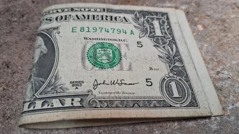 Close-up of a US one-dollar bill showing detailed currency design. Focused on Stock Photos