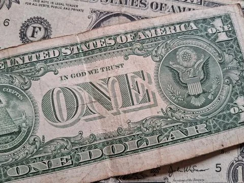 Close-up of US one dollar bills showing detailed currency design. Financial Stock Photos