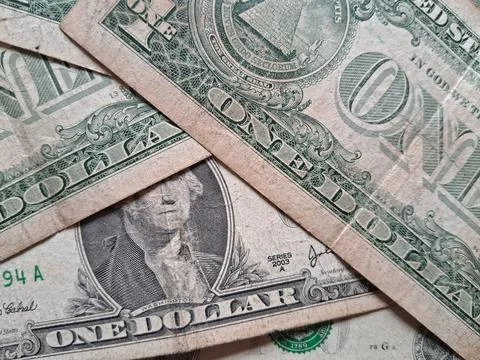 Close-up of US one dollar bills showing detailed currency design. Financial Stock Photos