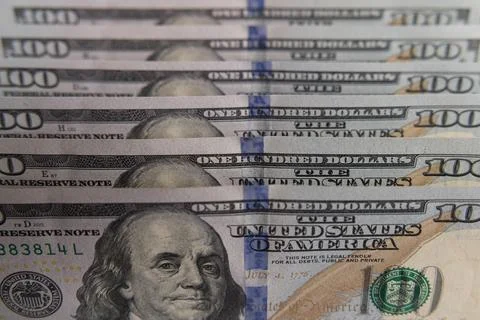 Close-up of US one hundred dollar bills stacked in diagonal rows with selec.. Stock Photos