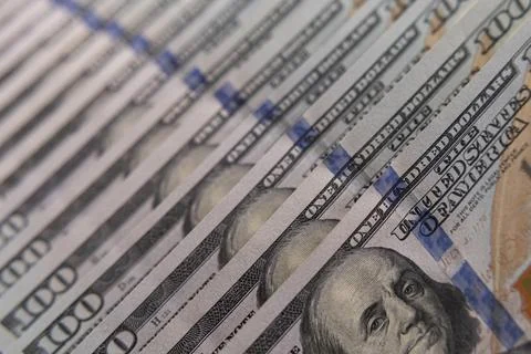 Close-up of US one hundred dollar bills stacked in diagonal rows with selec.. Stock Photos