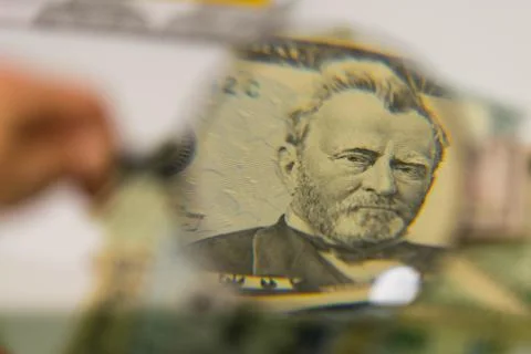 Close up of USA banknotes, 50 us dollars note in zoom of magnifying glass. Stock Photos