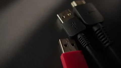 Close-up of USB and HDMI Cables on a Dark Surface Stock Footage 296159071
