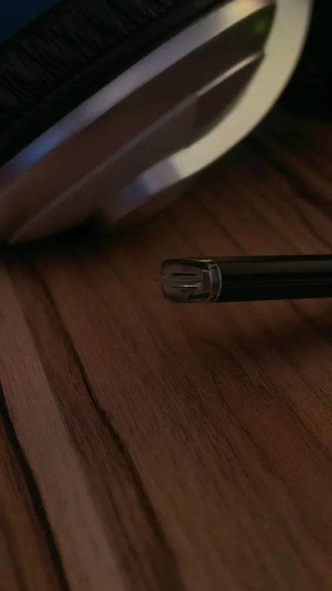 Close up USB cable connector near laptop on wooden desk, technology workspace, d Stock Footage 334603402