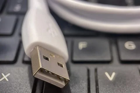 Close-Up of USB Cable on Keyboard. Stock Photos