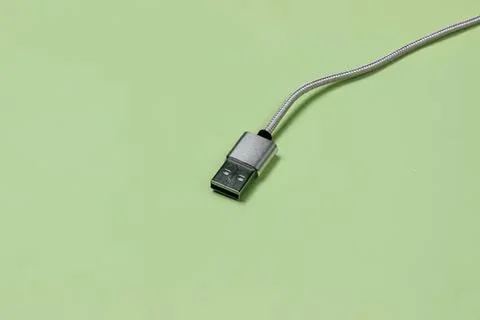 Close-up of a usb cable on a light green background Foto stock