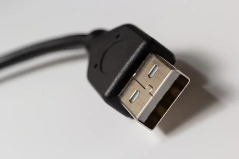 Close up of USB cable on white background. Data transfer technologies between Stock Photos