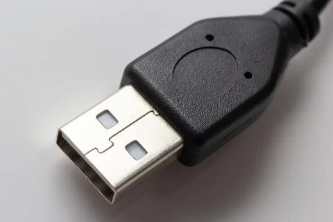 Close up of USB cable on white background. Data transfer technologies between Stock Photos