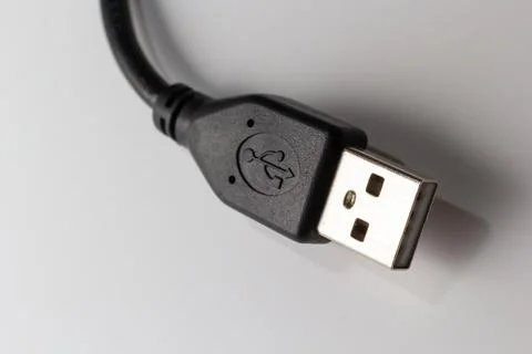 Close up of USB cable on white background. Data transfer technologies between Stock Photos