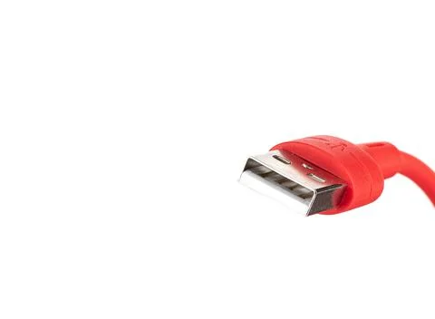 Close-up of a usb connector on a red cable on a white background. Stockfoto's