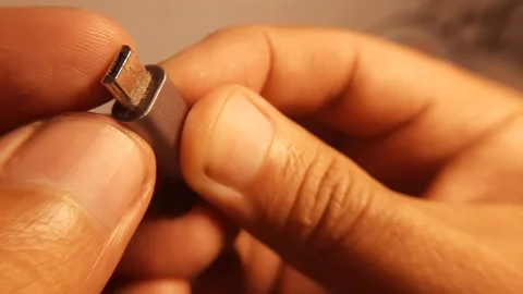 Close Up of USB Type-C Male to Micro USB Female Adapter Held in Hand 動画素材 341372170