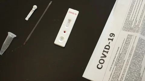 Close-up of the used test system for determining the coronavirus covid-19 by the Stock Footage 129015099