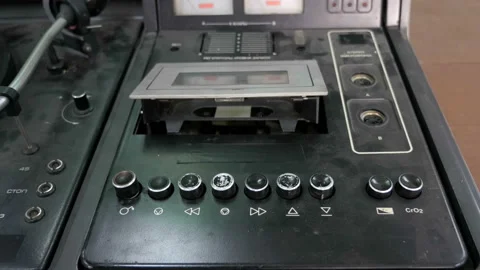 Close-up of using an antiquarian cassette player Stock Footage 99413408