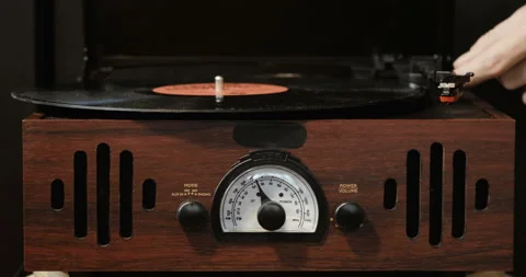 Close-up of using an antiquarian vinyl record player. turntable player,dropping Stock Footage 85845575
