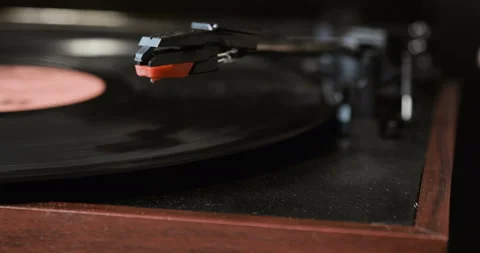 Close-up of using an antiquarian vinyl record player. turntable player,dropping Stock Footage 85853519