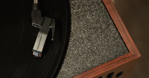 Close-up of using an antiquarian vinyl record player. turntable player,dropping Stock-Footage 85857238