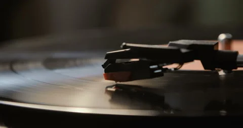 Close-up of using an antiquarian vinyl record player. turntable player,dropping Stock Footage 85865186