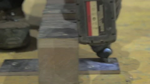 Close on Using Drill to Screw Into Wood Slow Motion Stock Footage 131107023
