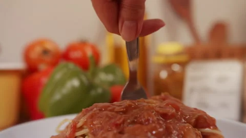 Close up of Using fork for twisting a spaghetti paste and forcemeat. Video stock 130665071