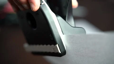 Close up of using a hole puncher in office, documents Stock Footage 159546670