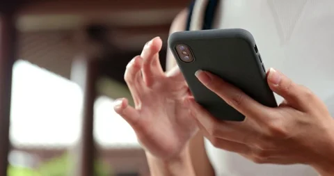 Close up of using mobile phone in Chinese garden Stock Footage 89202325