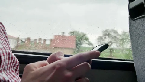 Close-up of using a mobile phone. Young man checking emails on his commute to a Video stock 75945620