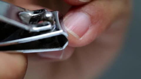 Close up Using nail clippers to cut fingernails Stock Footage 282469747
