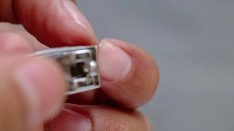 Close up Using nail clippers to cut fingernails Stock Footage 282469755
