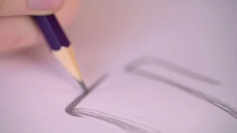 Close Up of Using Pencil in Sketchbook Stock Footage 123940532
