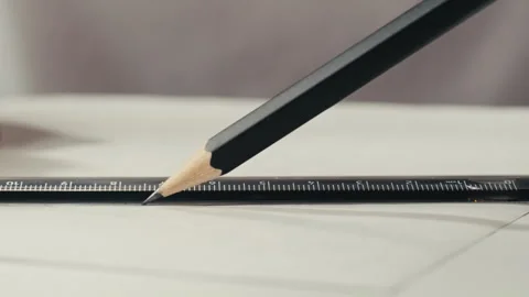 Close-up of using ruler drawing on white paper macro. Making some lines and Stock-Footage 276111944