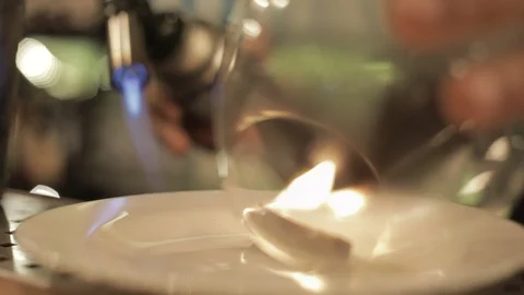 Close Up of Using Torch to Burn Cinammon and Make Flavored Smoke Stock Footage 129781508