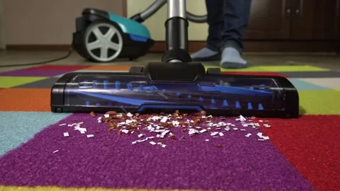 Close-up of using a vacuum cleaner to remove dust and debris from carpet. Stock-Footage 155211068