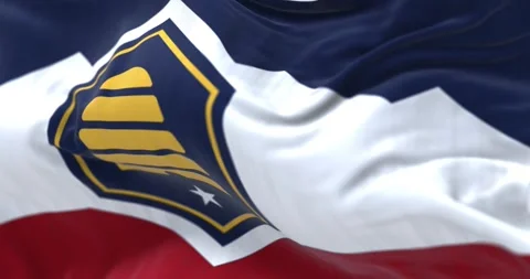 Close-up of the Utah Beehive Flag waving on a clear day Stock Footage 302448559