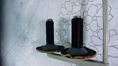 Close-up of a uterus of thread on a sewing machine Stock Footage 135866112
