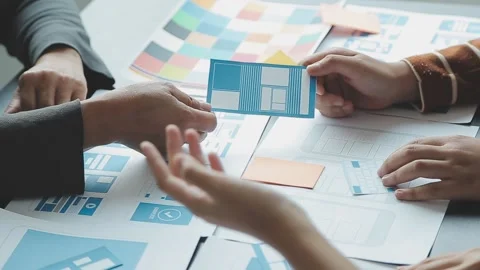Close up ux developer and ui designer brainstorming about mobile app interf.. Stock Footage 236827932