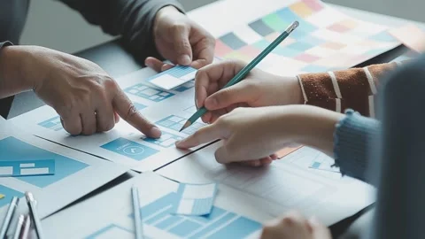 Close up ux developer and ui designer brainstorming about mobile app interf.. Stock Footage 236827947