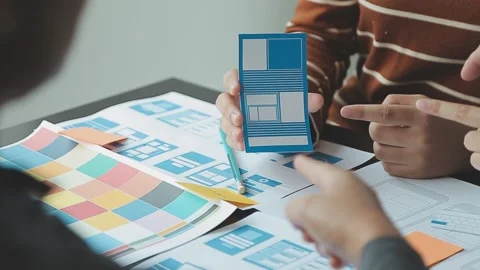 Close up ux developer and ui designer brainstorming about mobile app interf.. Stock Footage 236827962