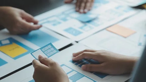 Close up ux developer and ui designer brainstorming about mobile app interf.. Stock Footage 236827984