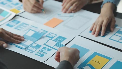 Close up ux developer and ui designer brainstorming about mobile app interf.. Stock Footage 236828010