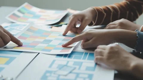 Close up ux developer and ui designer brainstorming about mobile app interf.. Stock Footage 236828011