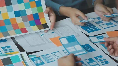 Close up ux developer and ui designer brainstorming about mobile app interf.. Stock Footage 236828043