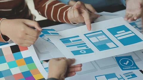 Close up ux developer and ui designer brainstorming about mobile app interf.. Stock Footage 236828102