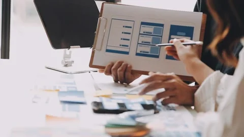 Close up ux developer and ui designer brainstorming about mobile app interf.. Stock Footage 236844557