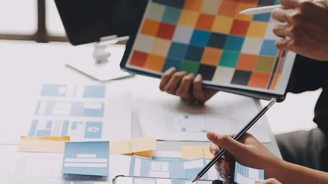 Close up ux developer and ui designer brainstorming about mobile app interf.. Stock Footage 236844571