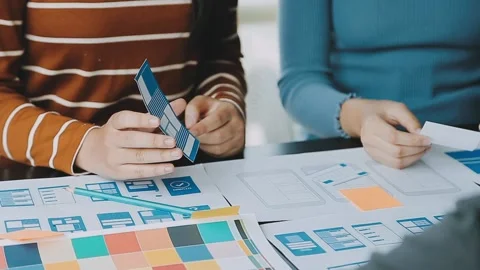 Close up ux developer and ui designer brainstorming about mobile app interf.. Stock Footage 236854165