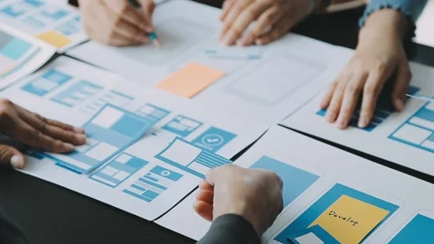 Close up ux developer and ui designer brainstorming about mobile app interf.. Stock Footage 236854174