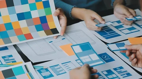 Close up ux developer and ui designer brainstorming about mobile app interf.. Stock Footage 236854176